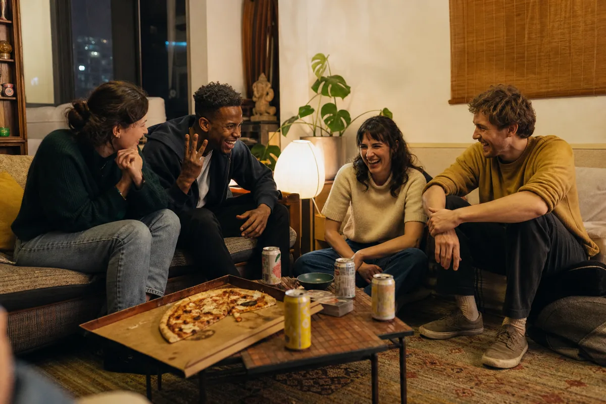Friends laughing together during game night