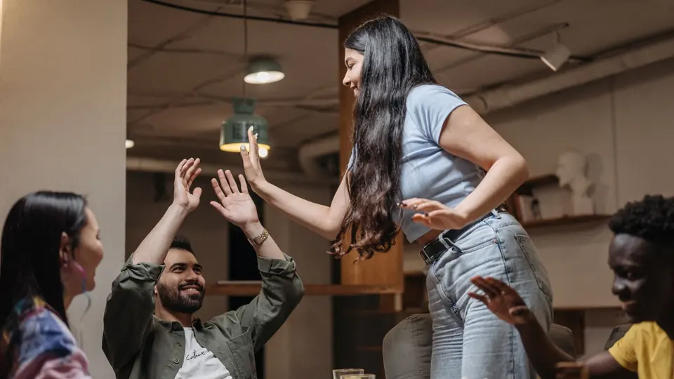 Friends playing a game at a table