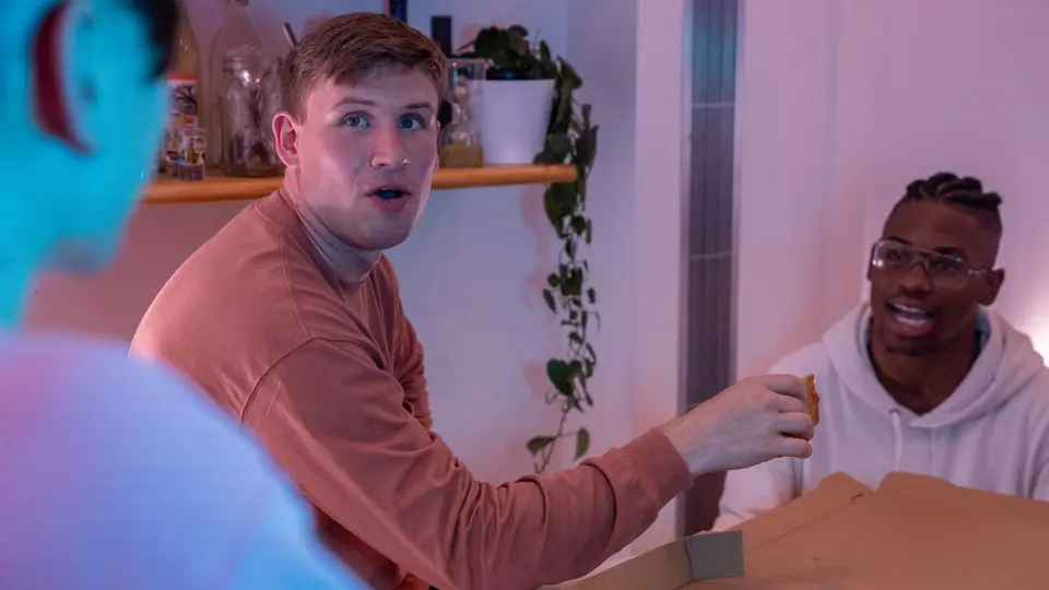 Friends talking together at home
