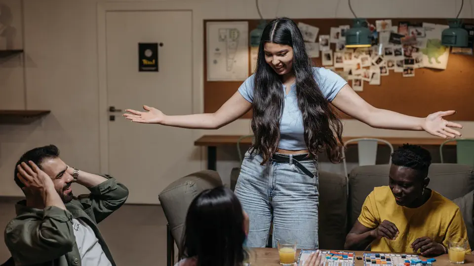 Friends laughing during a game night